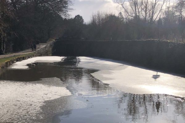 ice covering a canal lock pound