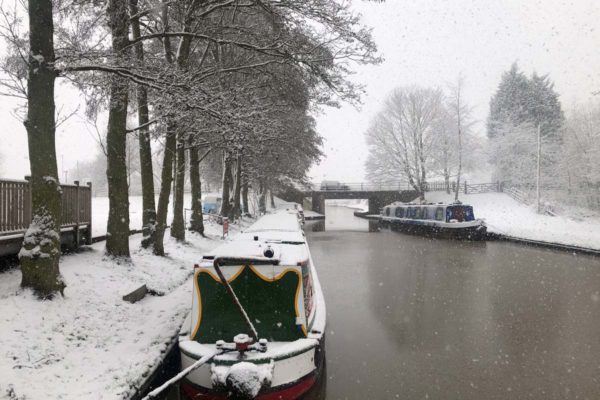 canal boats in the snow at great haywood